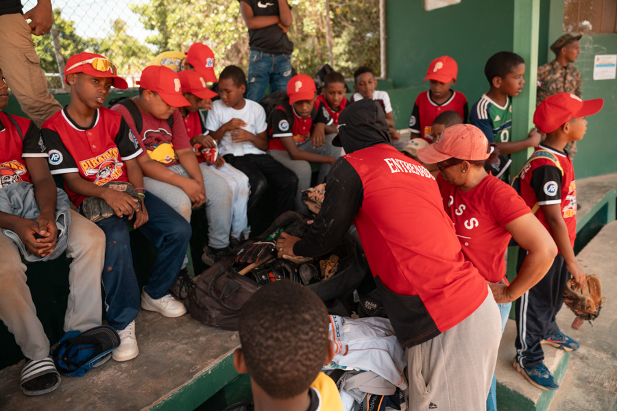 Baseball equipment being provided to youth players in Barahona